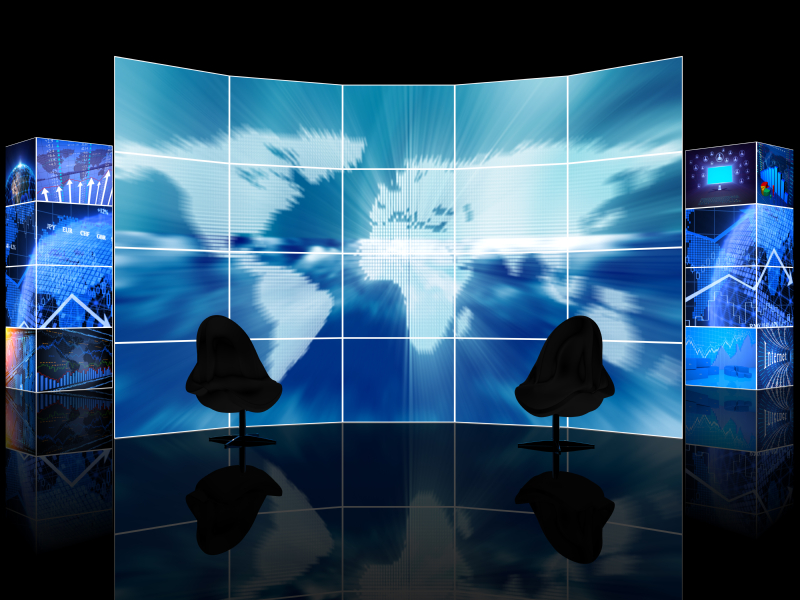 Digital news TV studio with two empty chairs in front of a large digital display featuring a map. (stock image)