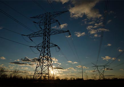 Overhead power lines at sunset. Image credit: flickr.com user Michael Kappel