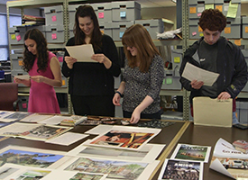 Kids peruse the Sayles archive.