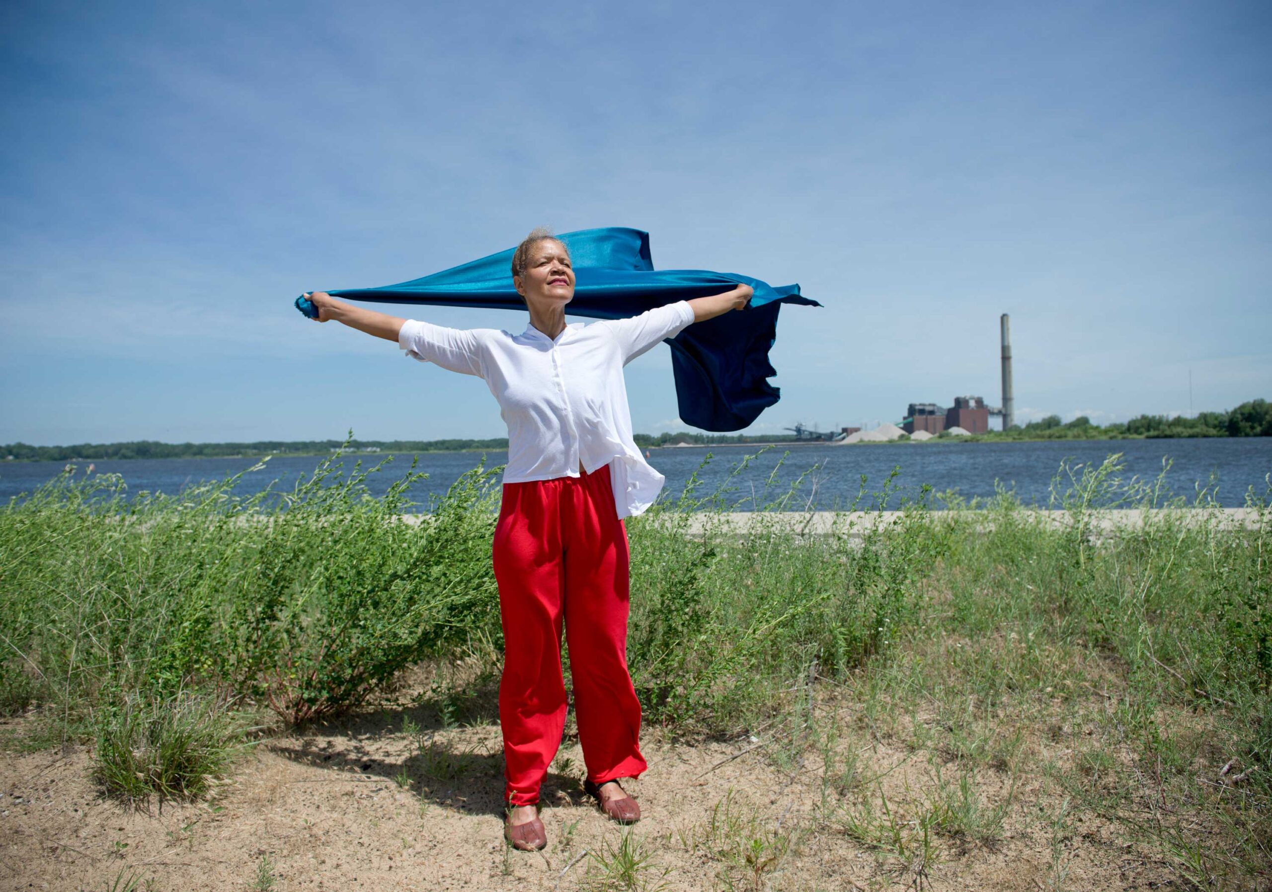 Robin Wilson, associate professor of dance, U-M School of Music, Theatre & Dance, runs through her solo for the upcoming Into the Wind performance on Muskegon Lake. 