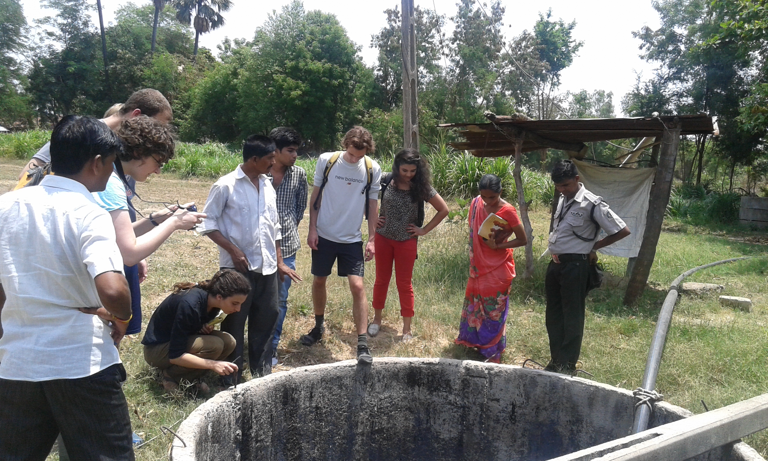 Bluelab India members Zoha Momin, Erica Dombro, Mitchell Borchers and Jon Minion survey a water well.