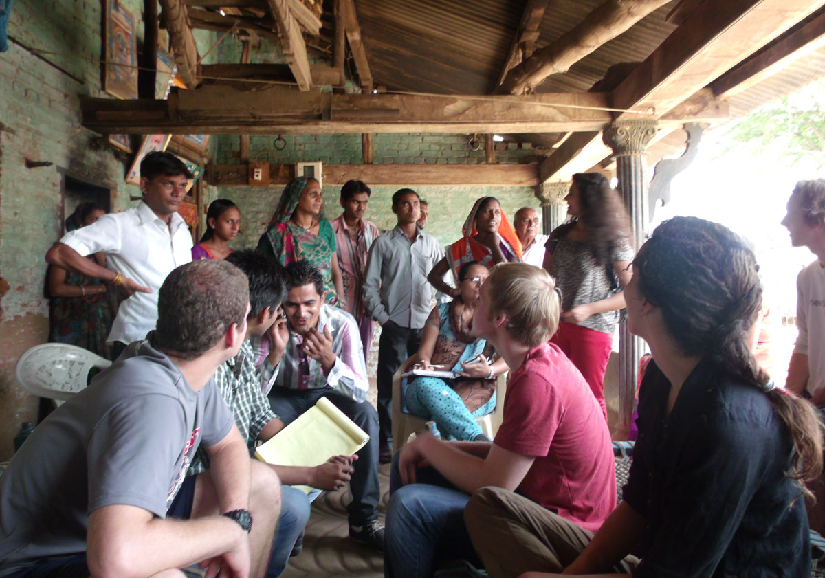 Bluelab India members Zoha Momin, Erica Dombro, Jon Minion and Mike McGahren-Clemens talk to villagers about their needs.