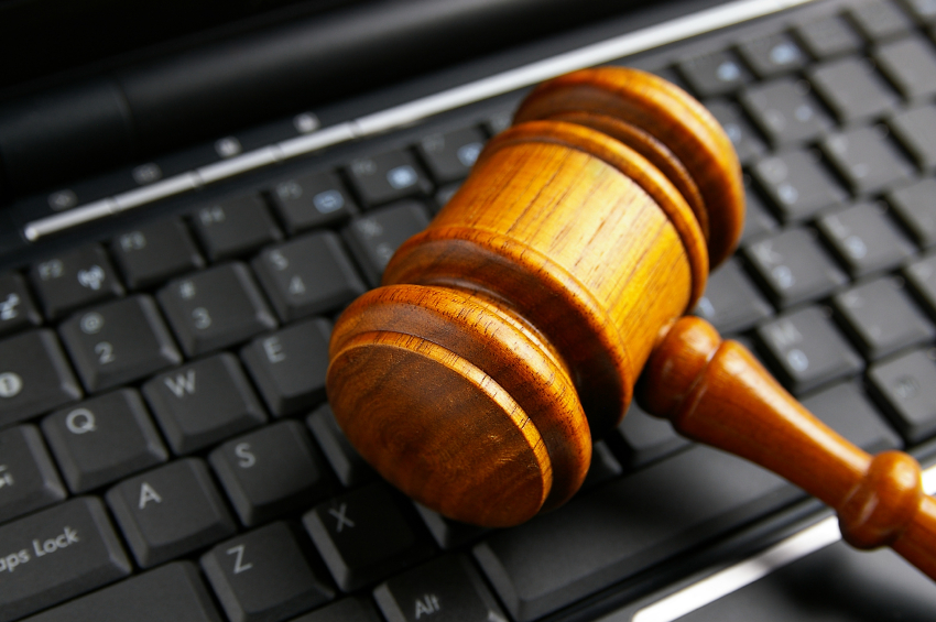 A gavel sits on a computer keyboard. (stock image)