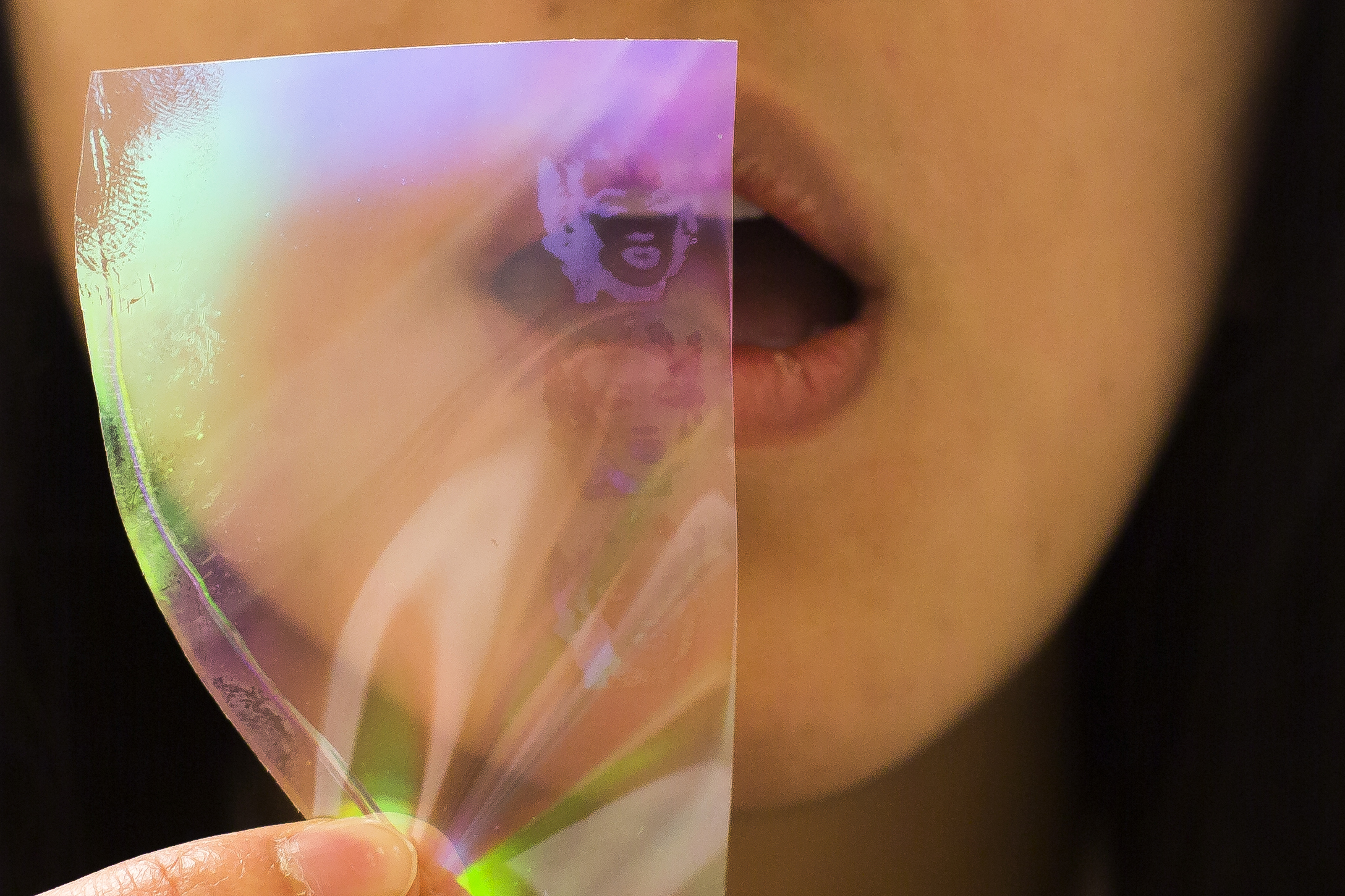 Terry Shyu, MSE PhD Student, demonstrates use of nanopillars that reveal hidden images via condensation of fluid on the structures. Image credit: Joseph Xu
