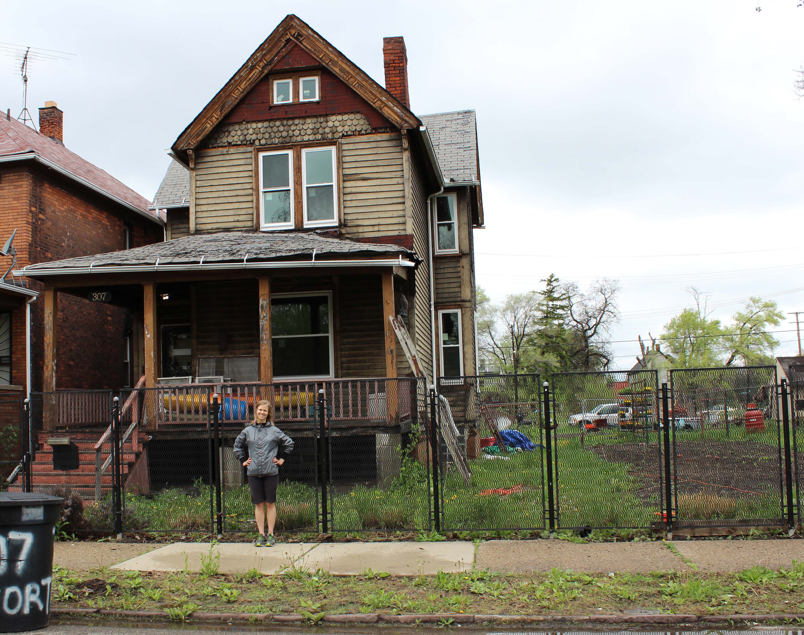 University of Michigan graduate student Lizzie Grobbel in front of the vacant Detroit house where she is raising shrimp, which she hopes to sell to restaurants, markets and others. Image credit: Lisa Pappas