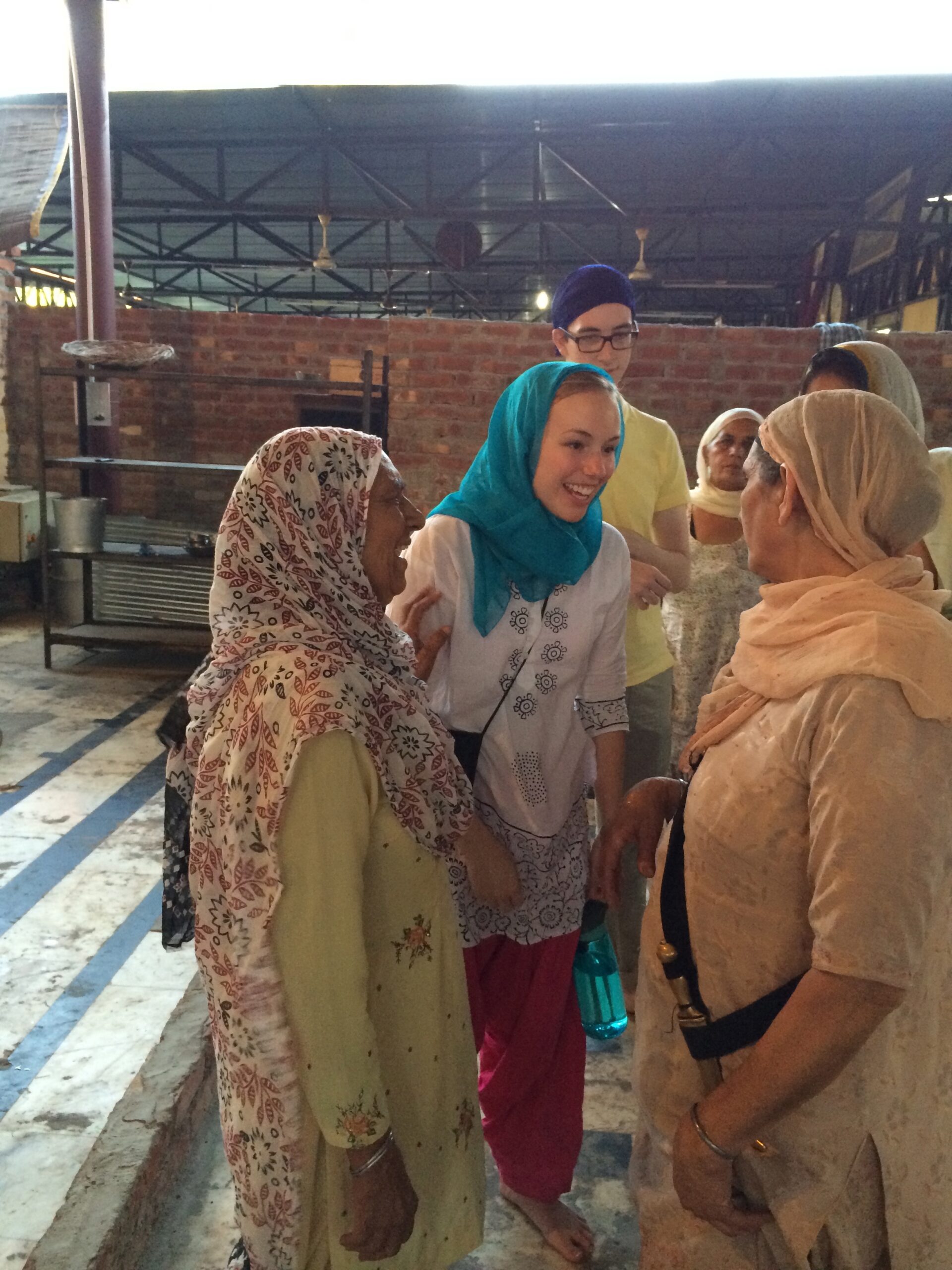 Jessica Eller talking and making new friends at the Golden Temple. Image credit: Teresa Singh