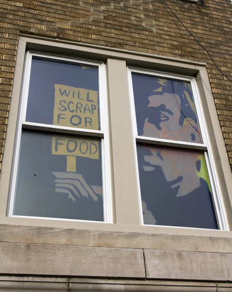 Artwork in the windows of a vacant apartment building in Detroit’s Cass Corridor neighborhood. Image credit: Nick Caverly
