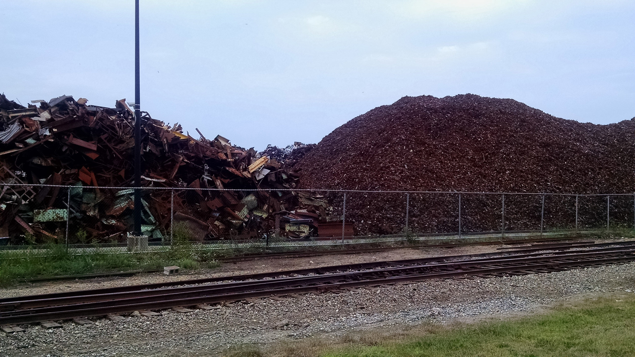 Piles of scrap metal line a railroad transfer station in southwest Detroit. Image credit: Nick Caverly