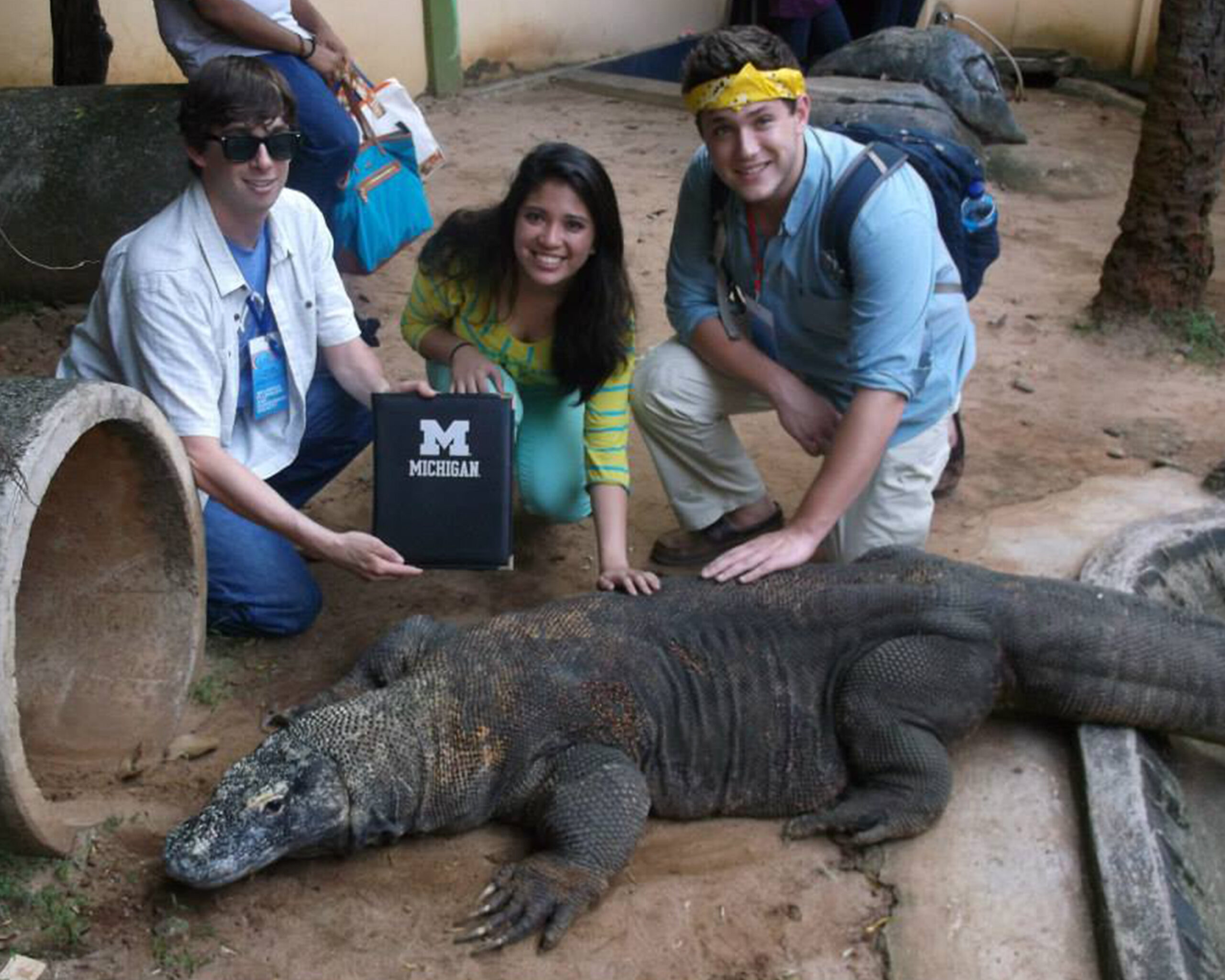 Students pose with a Komodo dragon, the world's largest species of lizard, in Jakarta, Indonesia. Image credit: Alex Leader