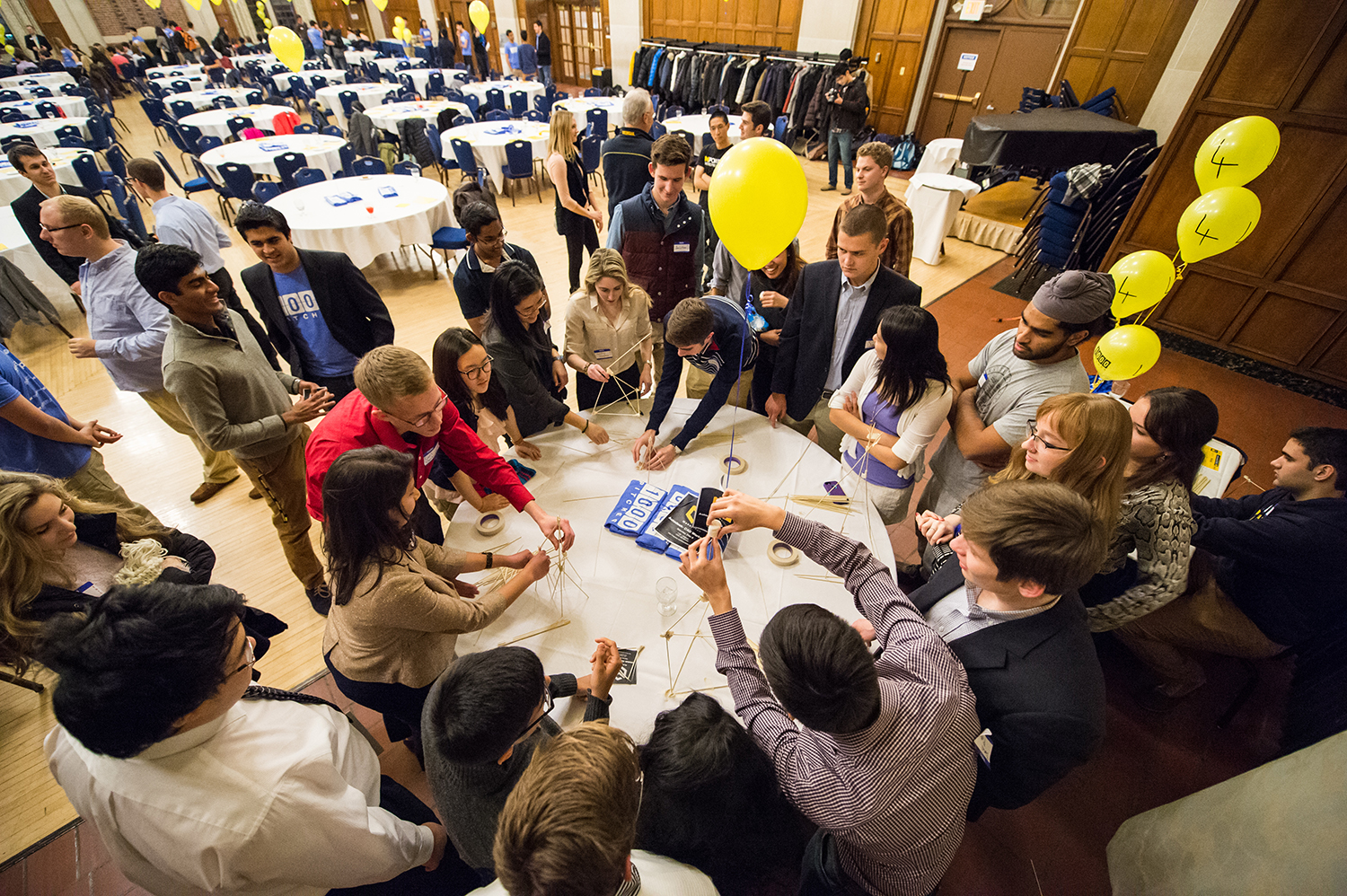 During a workshop at the 1,000 Pitches event, students used masking tape and thin wooden sticks to build the tallest tower that will support a marshmallow at the top. Image credit: Austin Thomason, Michigan Photography