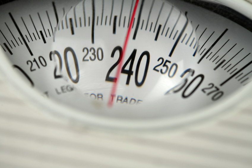 A scale shows 239 pounds. (stock image)