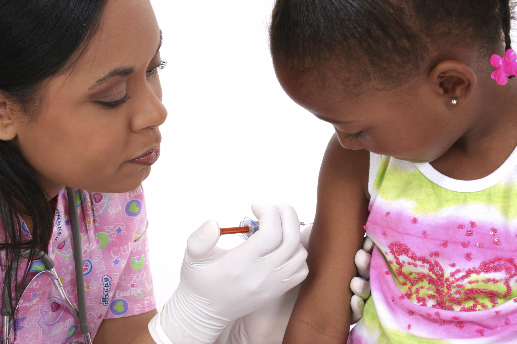 A nurse administers a vaccination to a young girl. (stock image)