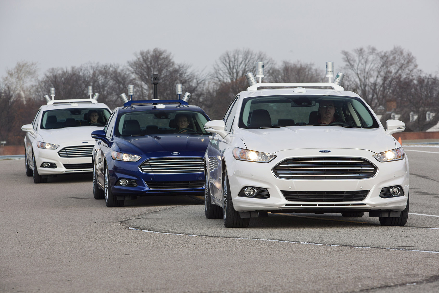 Three Ford Fusion autonomous test vehicles.