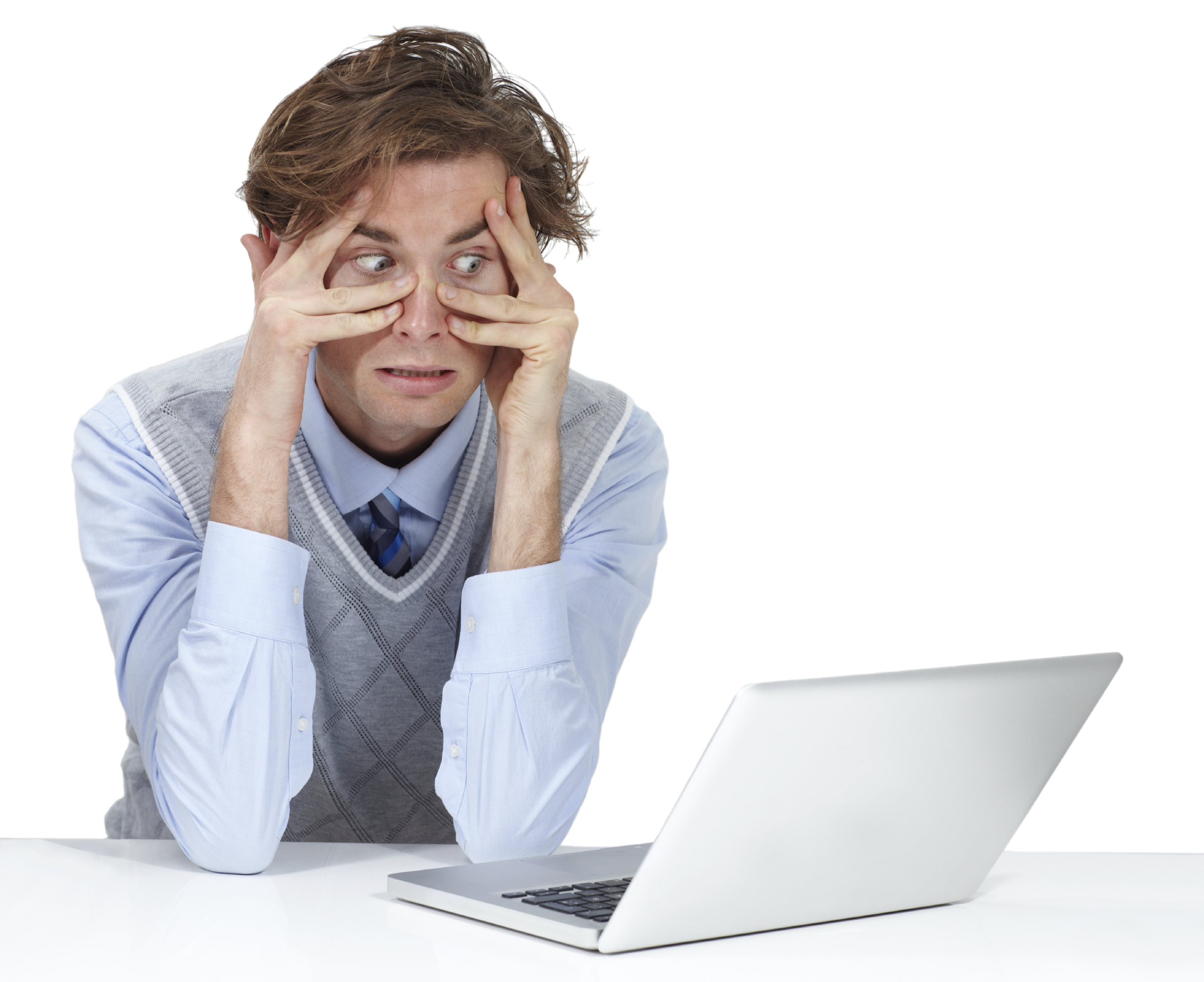 A peeks through his fingers at the laptop screen. (stcok image)