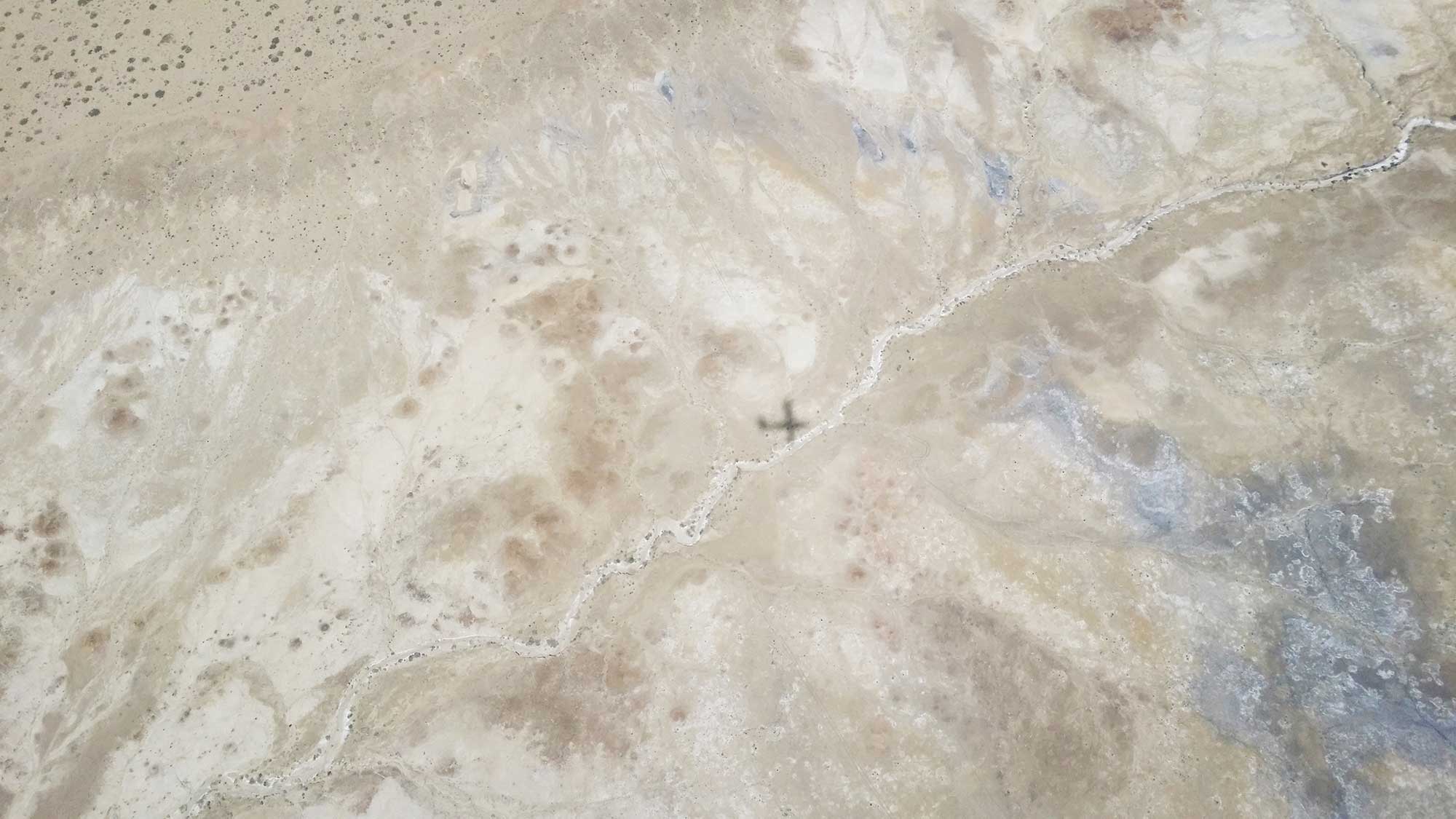The shadow of the Twin Otter aircraft on the Four Corners region of the U.S. University of Michigan engineering researchers rode in the aircraft to measure atmospheric methane. Image credit: Sonja Wolter