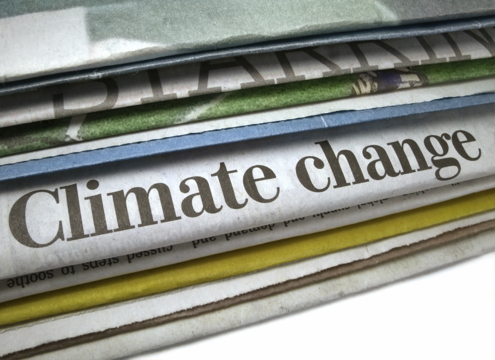 A stack of newspapers with a headline, Climate Change. (stock image)