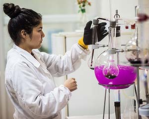 A worker analyzes wine at the Viu Manent Winery in Valle Colchagua, Chile.