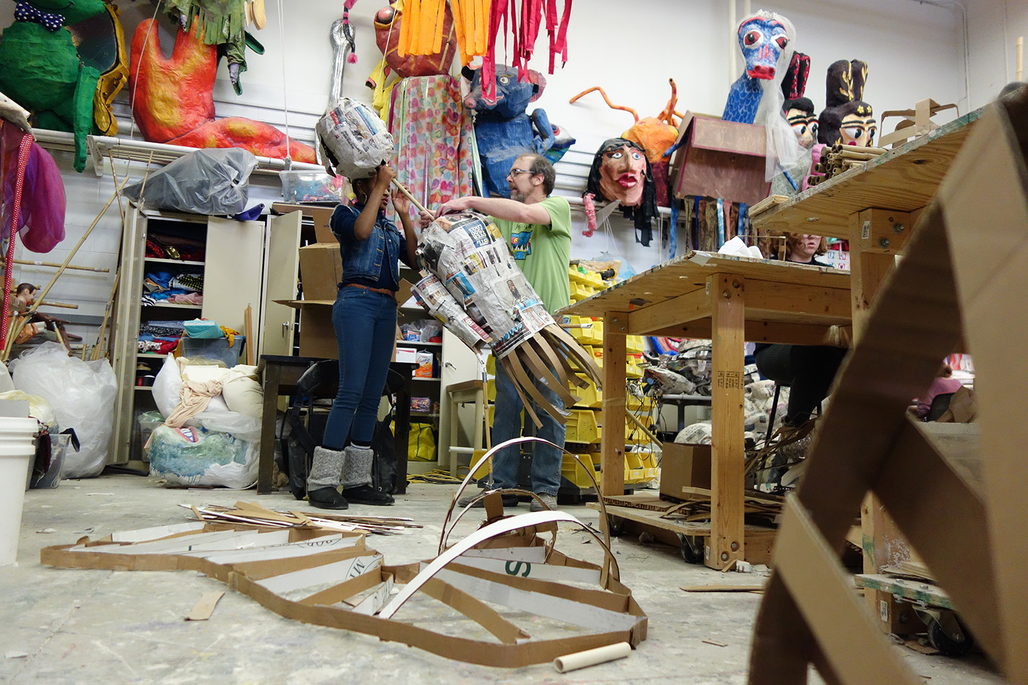 Mark Tucker (right) assists U-M student Kaitlyn Moore (left) with her project in the Festifools Workshop. Image credit: Sydney Hawkins