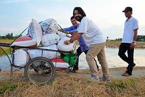 Maruta wheels away some cacao beans from a Vietnamese farm.