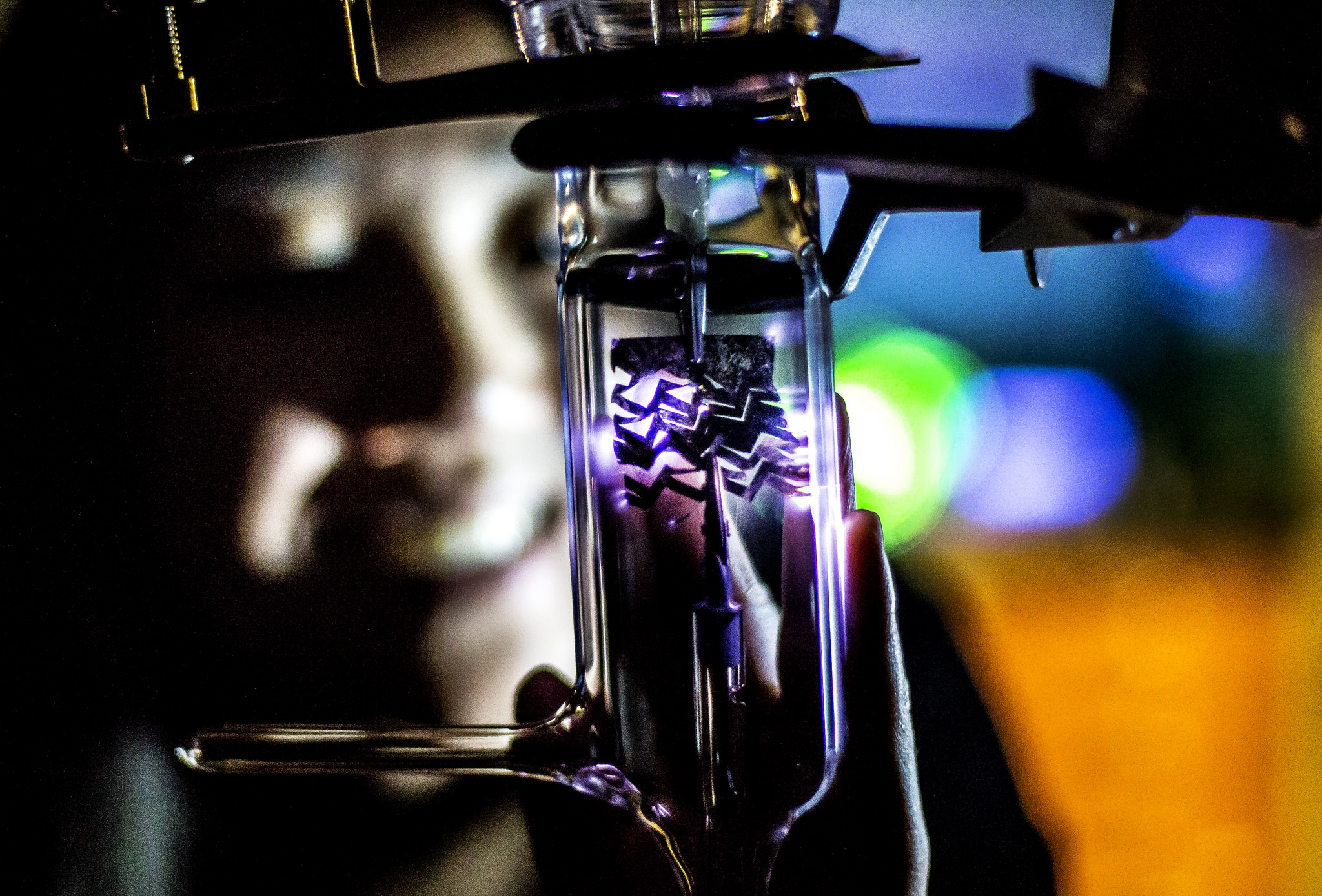 Terry Shyu, MSE PhD Student and Graduate Research Assistant, demonstrates a stretchable conductor's ability to conduct. Image credit: Joseph Xu, Michigan Engineering