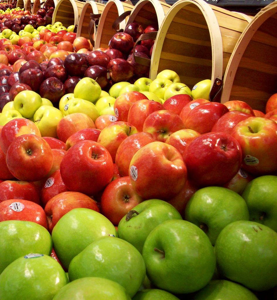 A few bushels of different kinds of apples.