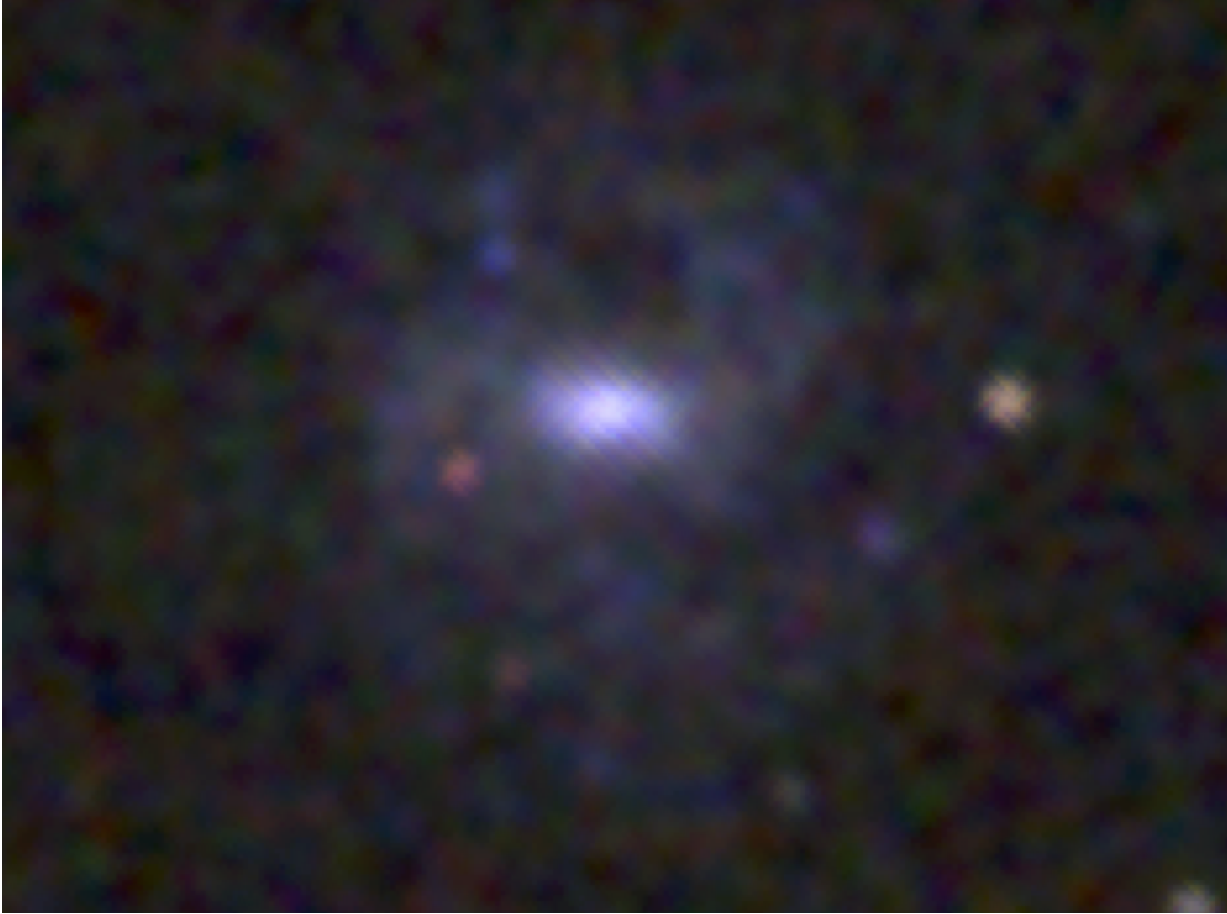At the core of the dwarf galaxy RGG 118, University of Michigan astronomers have found the smallest supermassive black hole ever discovered. Credit: Vivienne Baldassare, University of Michigan