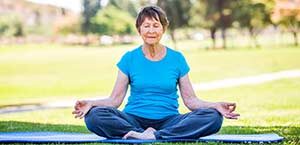 Older lady meditates, stock