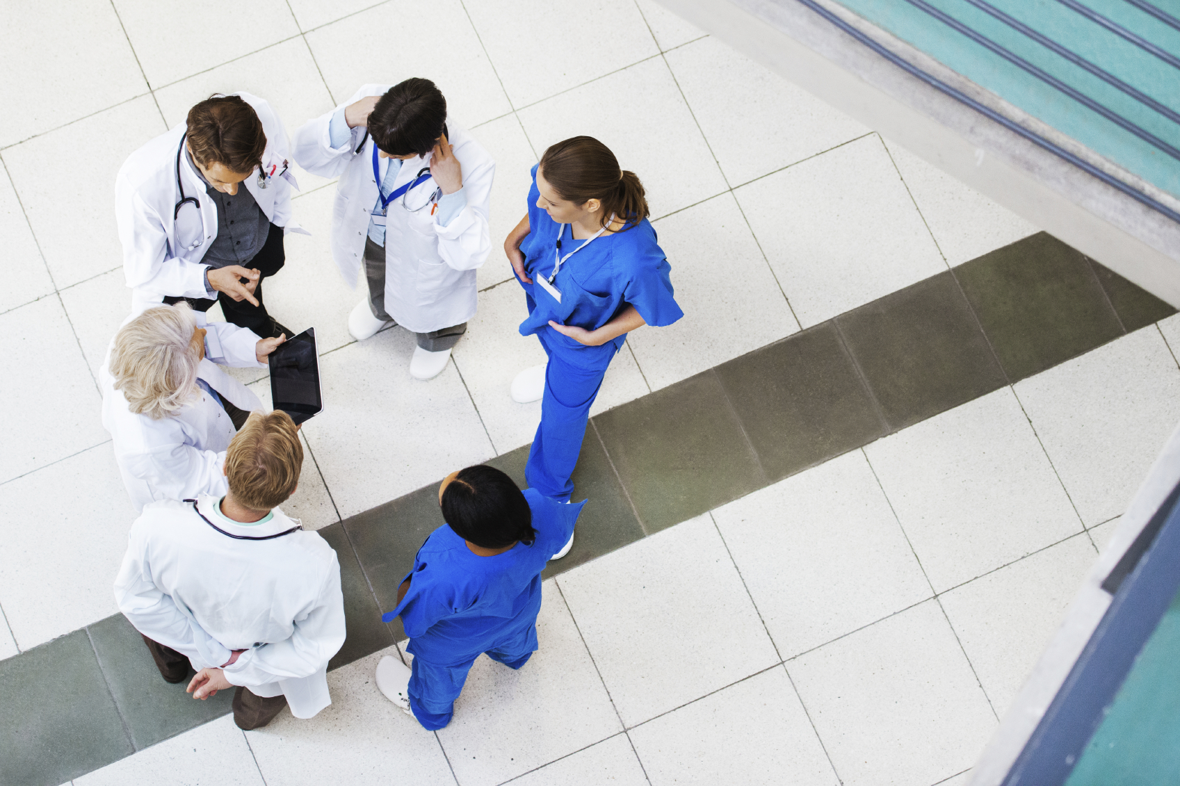Doctors discussing a case in the lobby. (stock image)