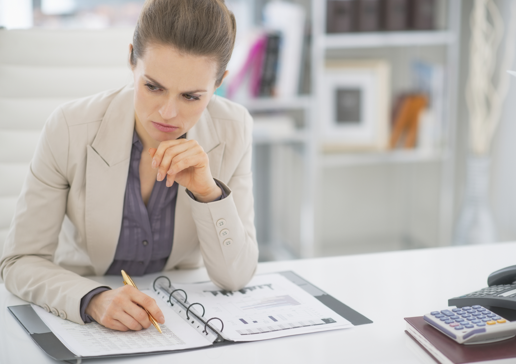 A woman working in finance. (stock image)