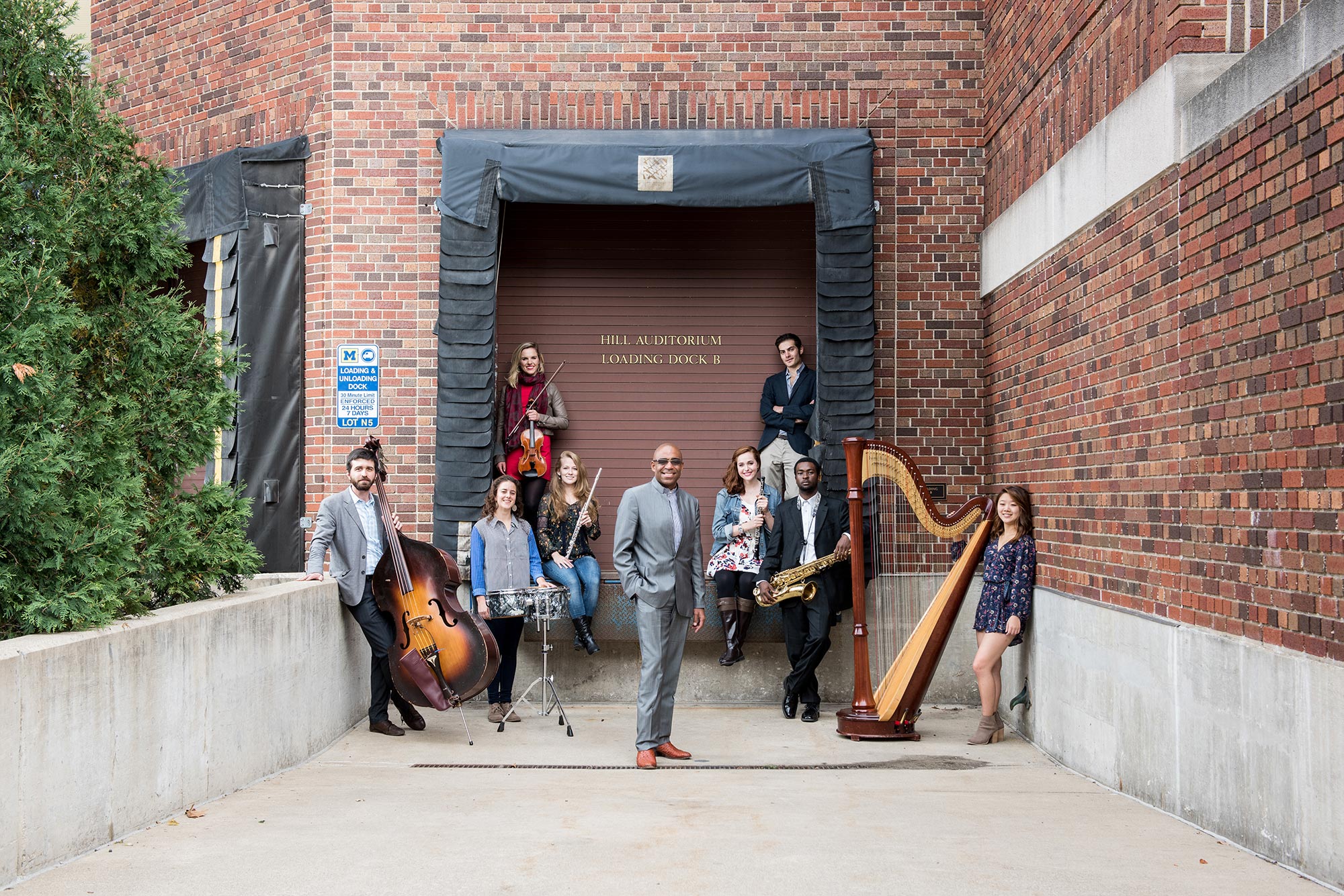 University of Michigan School of Music, Theatre & Dance students outside of Ann Arbor's historic Hill Auditorium.  The first $100,000 grand prize winner of the M-Prize Chamber Arts Competition will be awarded at Hill Auditorium on May 20, 2016.  Left to Right: Andrew Peck, Nicole Patrick, Max Karmazyn, Stephen Grady, Heather Kendrick, Anna Gilpatrick, Anita Graef, Bret Patterson, Anna Thompson, Belinda Rosen, Annie Jeng, Christine Stinchi, Catherine Miller. Image credit: Eric Bronson, Michigan Photography