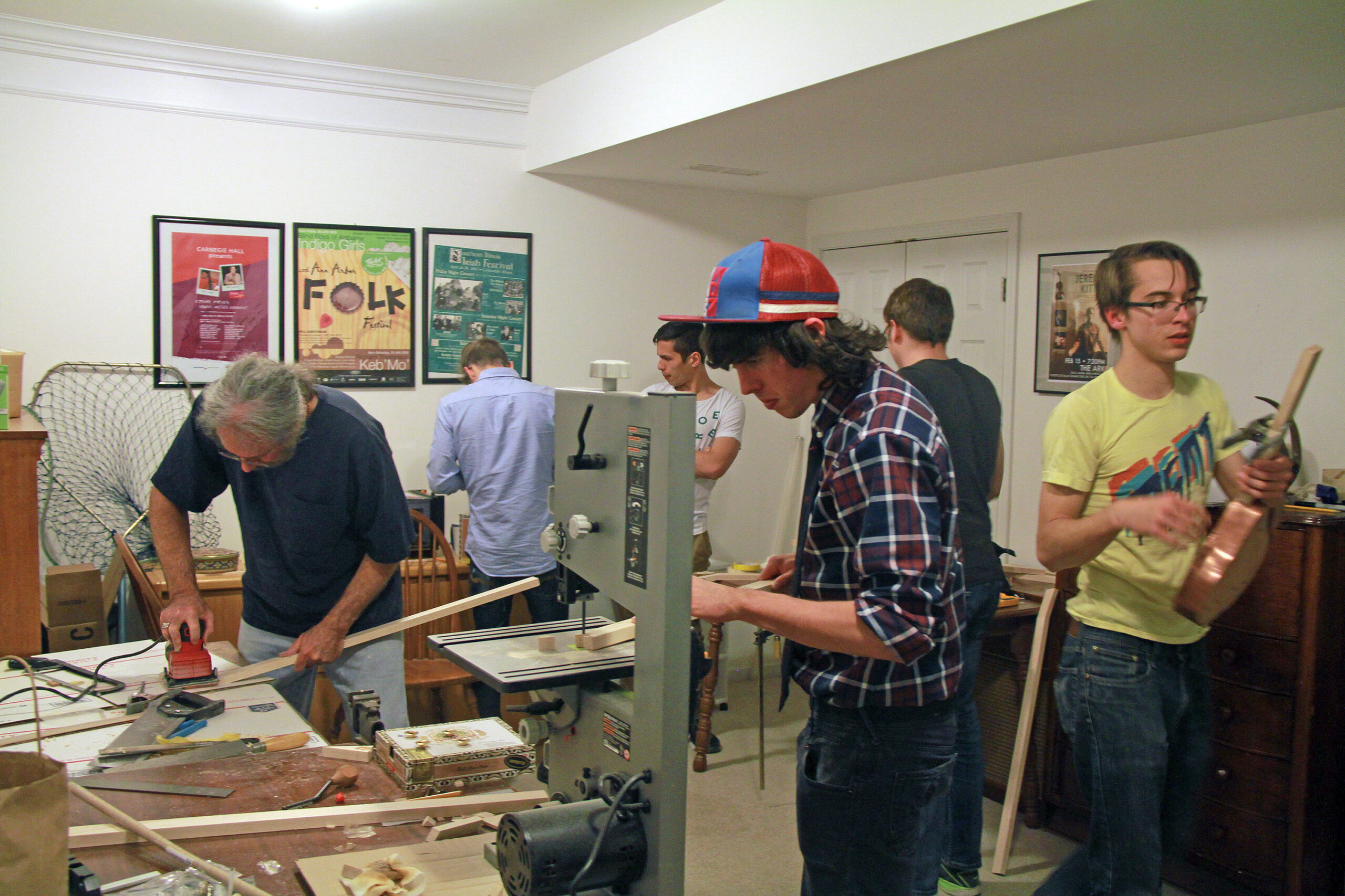 Students fashion instruments out of cigar boxes, wood and wire. The activity was one from a winter course, during which the students learned about roots music and prepared for the tour. From left: Bruce Conforth (LSA American Culture), Adrian Koch (SMTD), Christopher O’Brien (SMTD), Joseph Fingerle (LSA), Kellen Marceau (LSA), Mark Dulchavsky (LSA).