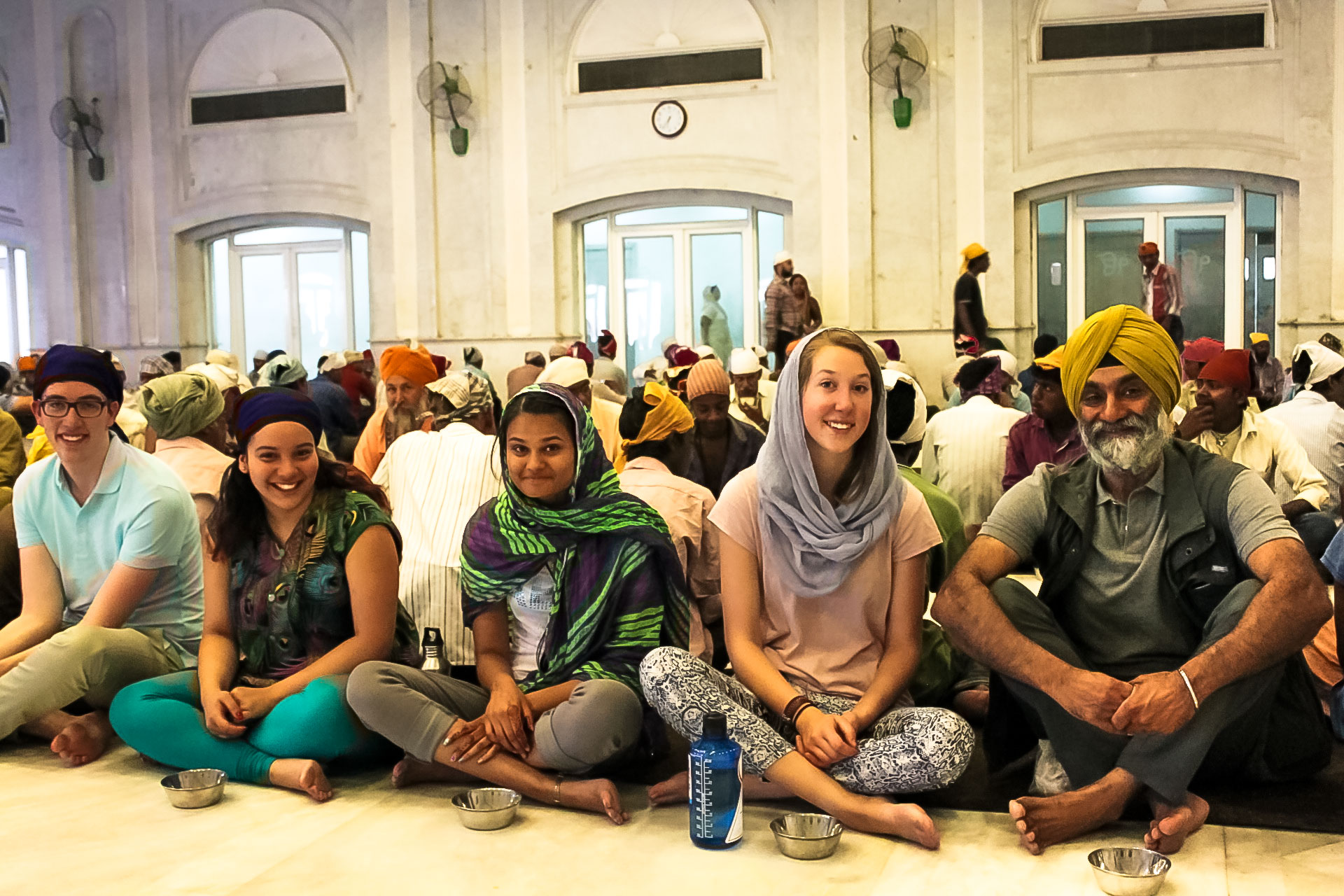 Jasprit Singh (right), professor of electrical engineering and computer science, leads a group of U-M students on a visit to the Golden Temple, one of India's biggest shrines. Image credit: Teresa Singh