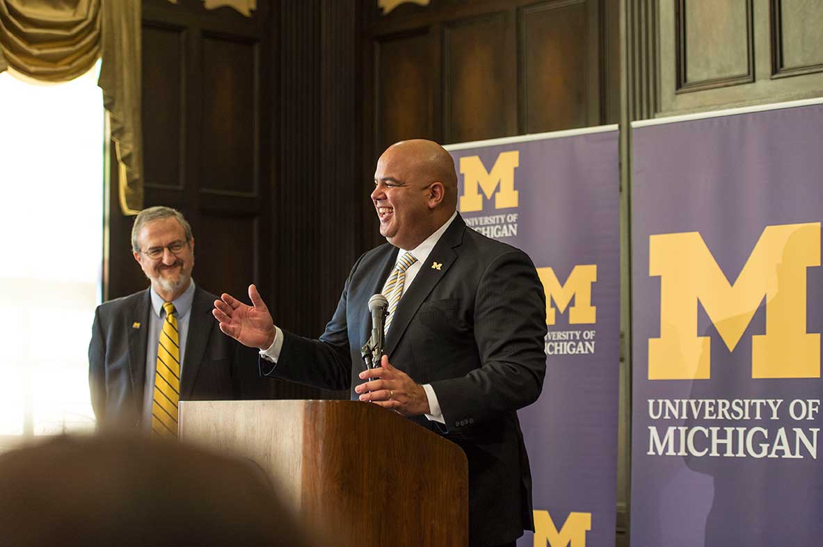 The University of Michigan president Mark Schlissel introduces new athletic director Warde Manuel during a press conference at the Michigan Union on Jan. 29, 2016. Image credit: Michigan Photography
