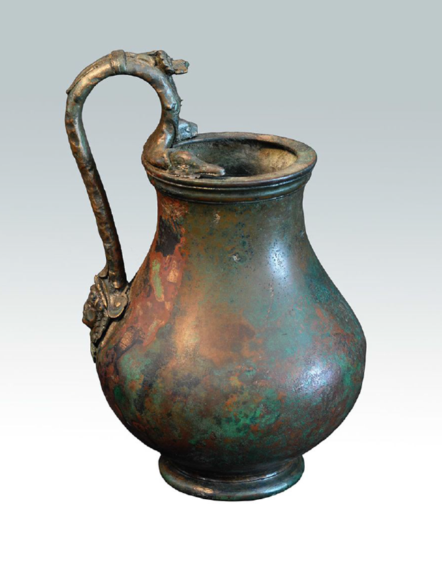Bronze pitcher decorated with aquatic animals and mask. Image courtesy Kelsey Museum
