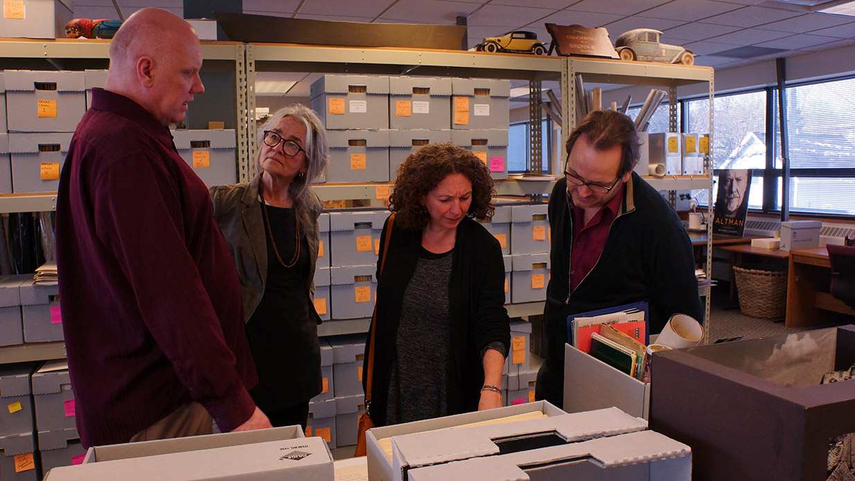 Pictured (left to right): Screen Arts Mavericks and Makers collection curator Philip Hallman, head archivist at the U-M Special Collections Library Kathleen Dow, Nancy Savoca, and Rich Guay during a recent visit to the U-M Special Collections Library, where the Screen Arts Makers & Mavericks Collection is held.