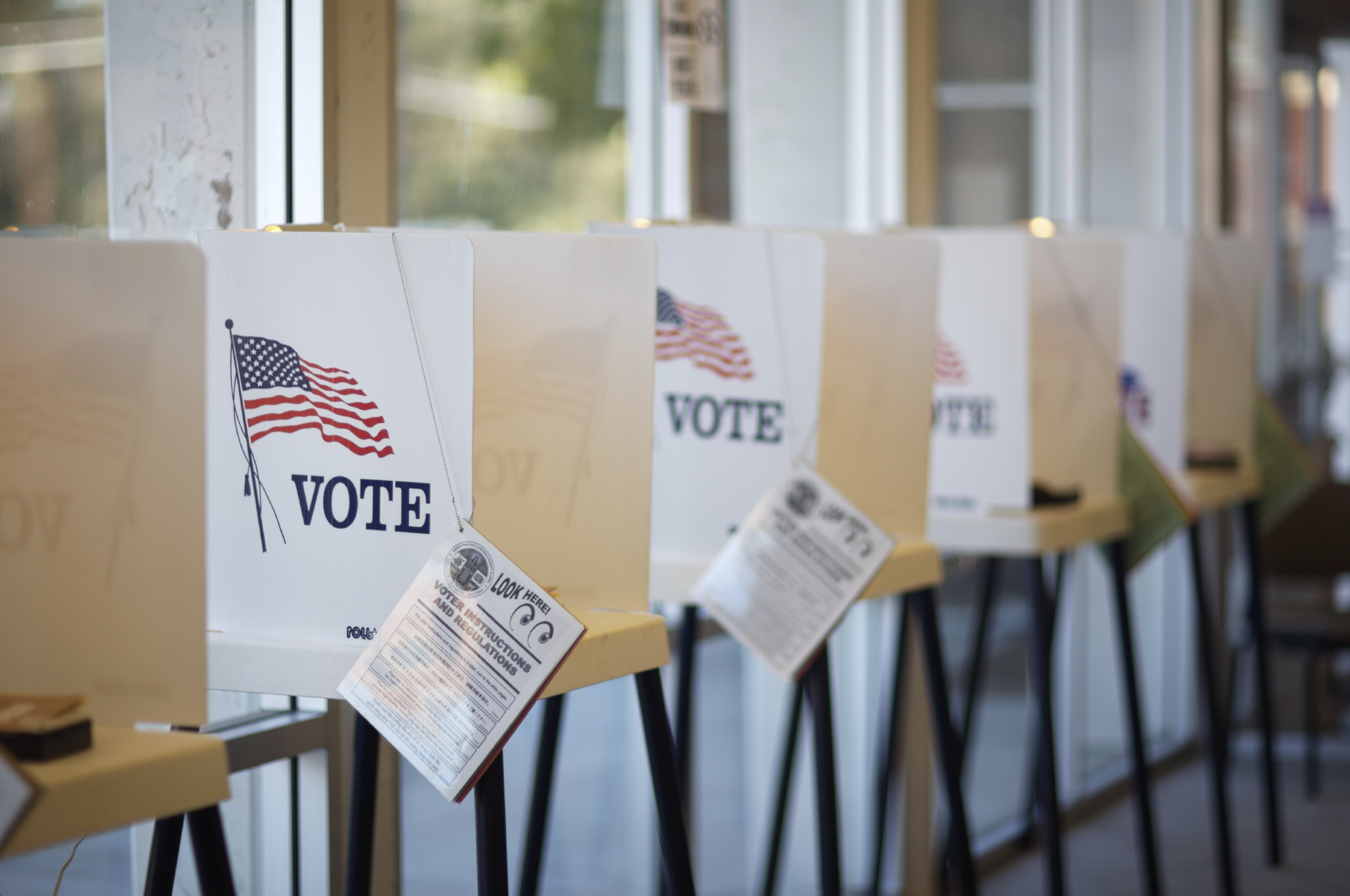 A row of ballot booths against a wall. (stock image)