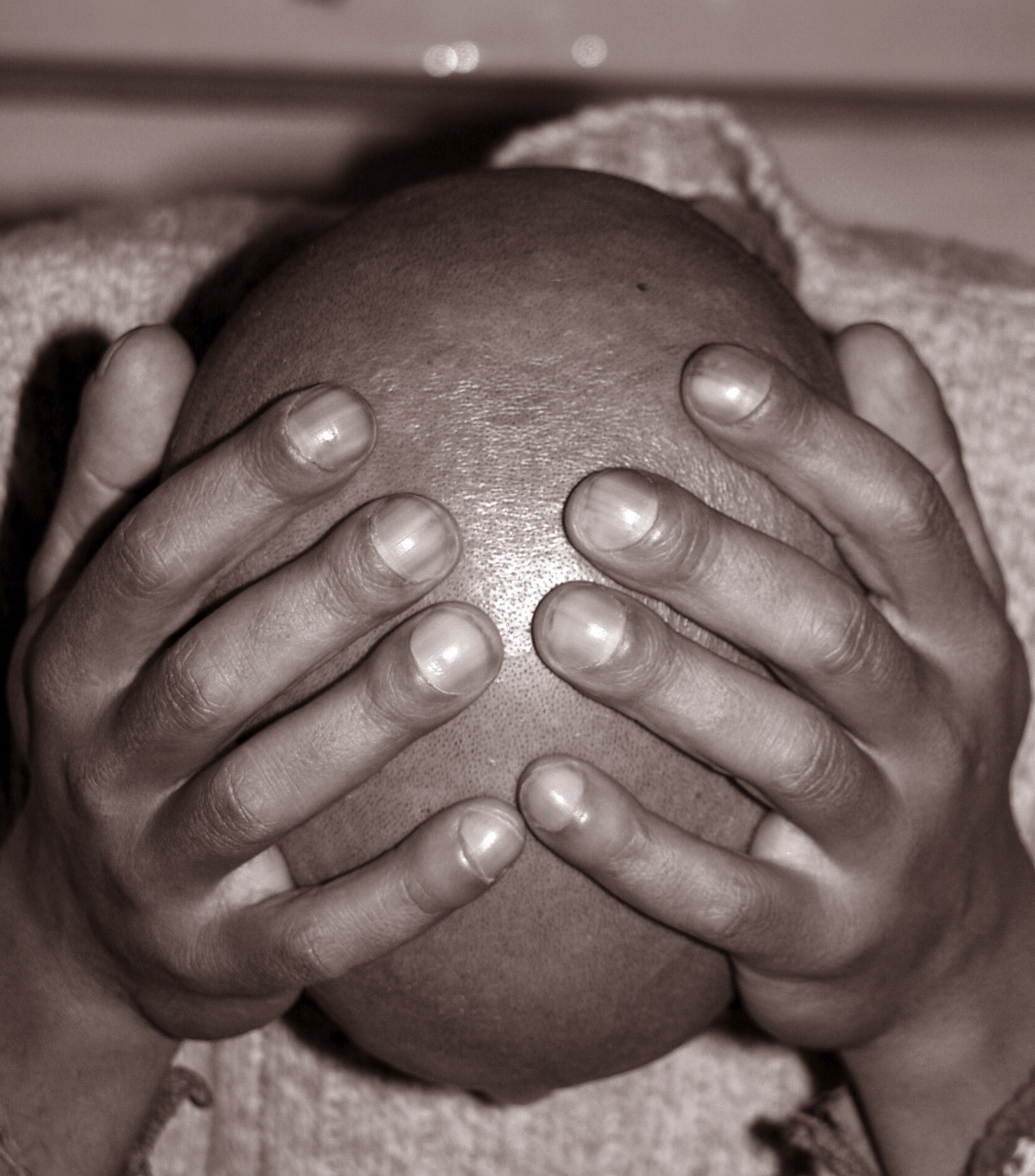 A man holds his head. (stock image)