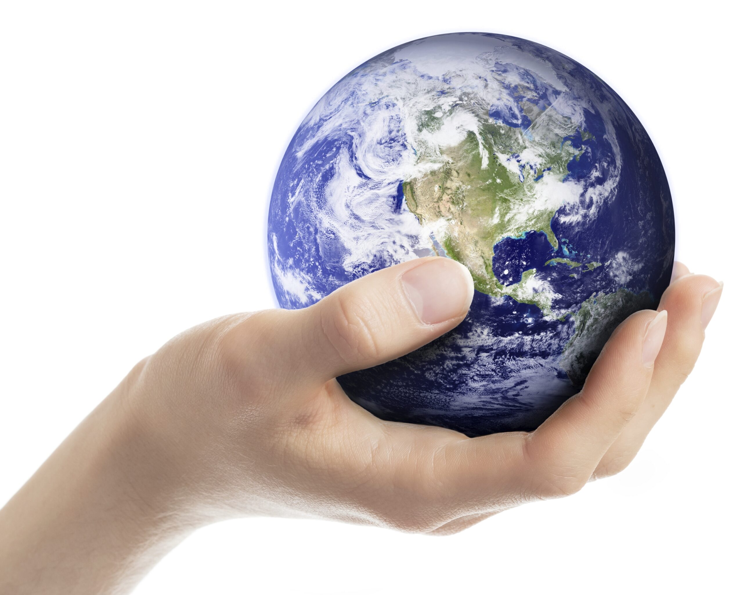A hand holding a small model of earth. (stock image)