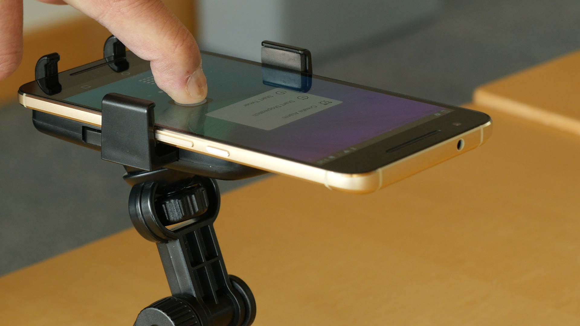 ForcePhone, new software developed by University of Michigan engineering researchers, enables the body of any smartphone to sense force. It could let you command your phone by squeezing it. Image credit: Kelly O'Sullivan
