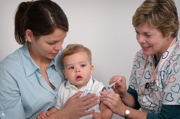 Held by his mother, this seventeen month old infant was receiving an intramuscular immunization in his left shoulder muscle from a qualified nurse. With her free hand, the nurse was stabilizing the injection site. Image credit: James Gathany via CDC/ Judy Schmidt