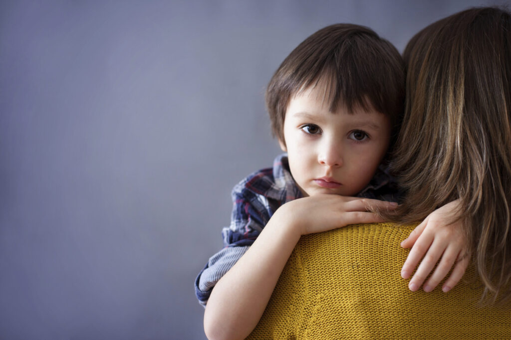 A mother hugs her son. Image credit: iStock