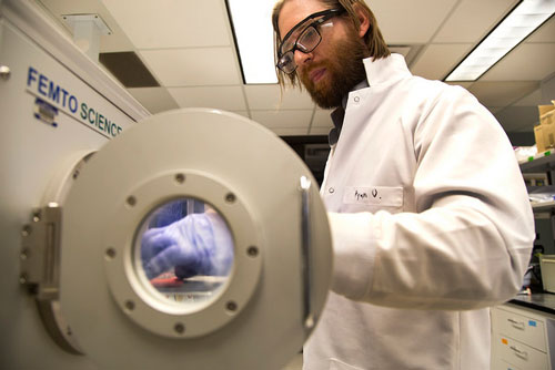 Ryan Oliver, Post-Doctorate Researcher, fabricates a special microchip that can simulate different organs and parts of the body in a plasma chamber. Image credit: Joseph Xu