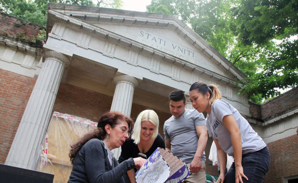Students and faculty members from Taubman College will represent the U.S., Canada and Kuwait in the world’s top architecture show. From left: U-M Taubman fellows Kristen Gandy, Ramon Hernandez and Diana Tsai map out installation plans in front of the U.S. pavilion with Chiara Barbieri, Peggy Guggenheim Collection manager. It is located within the Castello Gardens that house all the national pavilions of the Venice Biennale. Image credit: Salam Rida