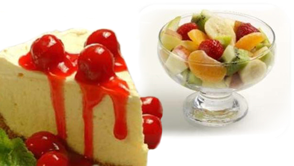 Cheesecake and a bowl of fresh fruit. (stock image)
