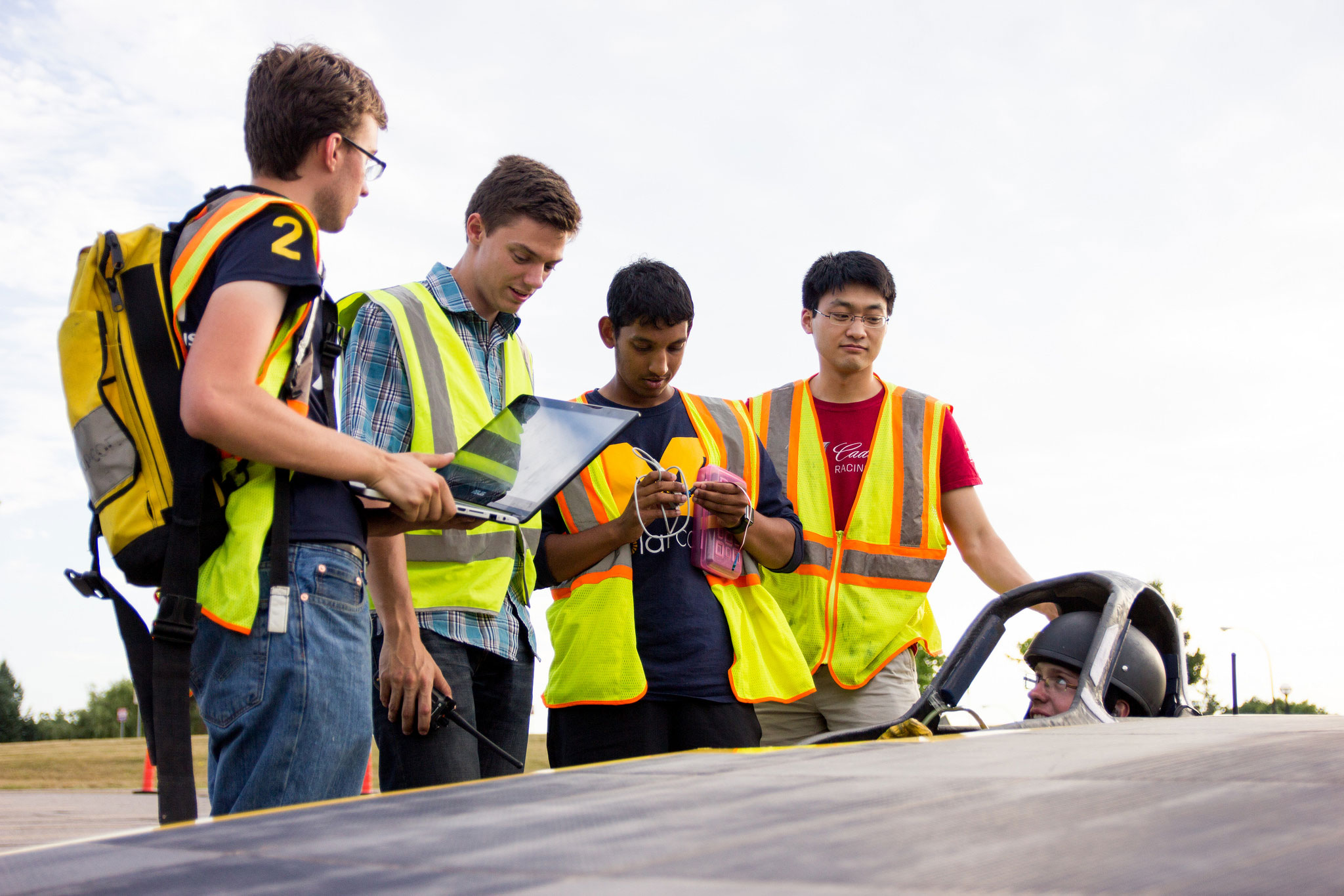 Students, Michael Toennies, Perry Benson, Karthik Bhandarkar, Denny Zhang and Andrew Toennies discuss telemetry (Images courtesy: U-M Solar Team)