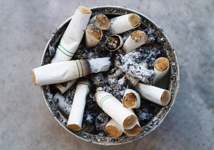 A container filled with cigarette butts (stock image).
