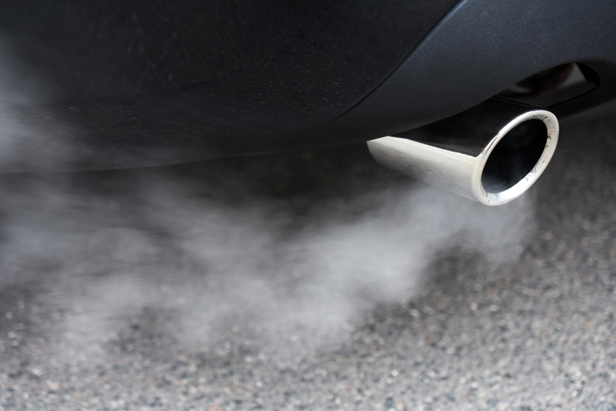 Exhaust comes from a car's tailpipe. (stock image)