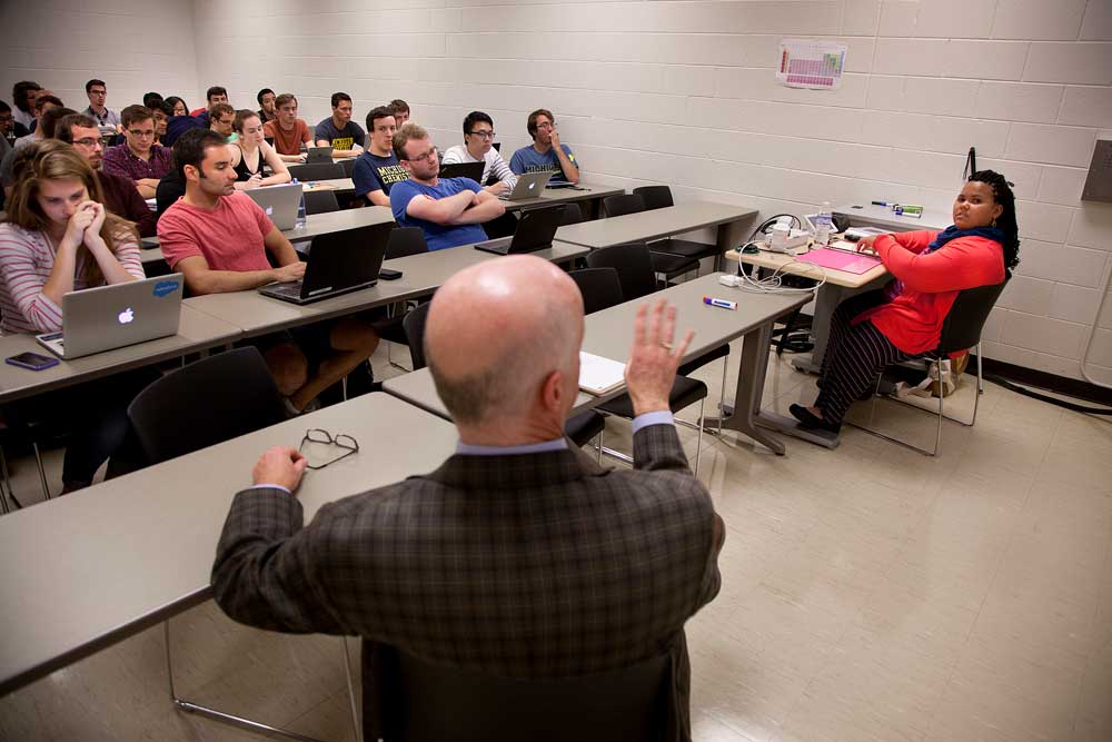 India West, 17, sits at the head of EECS 481, a software engineering course taught by David Chesney. In the Fall 2016 semester she worked with the senior class to develop technologies for the visually impaired. Photo by Marcin Szczepanski