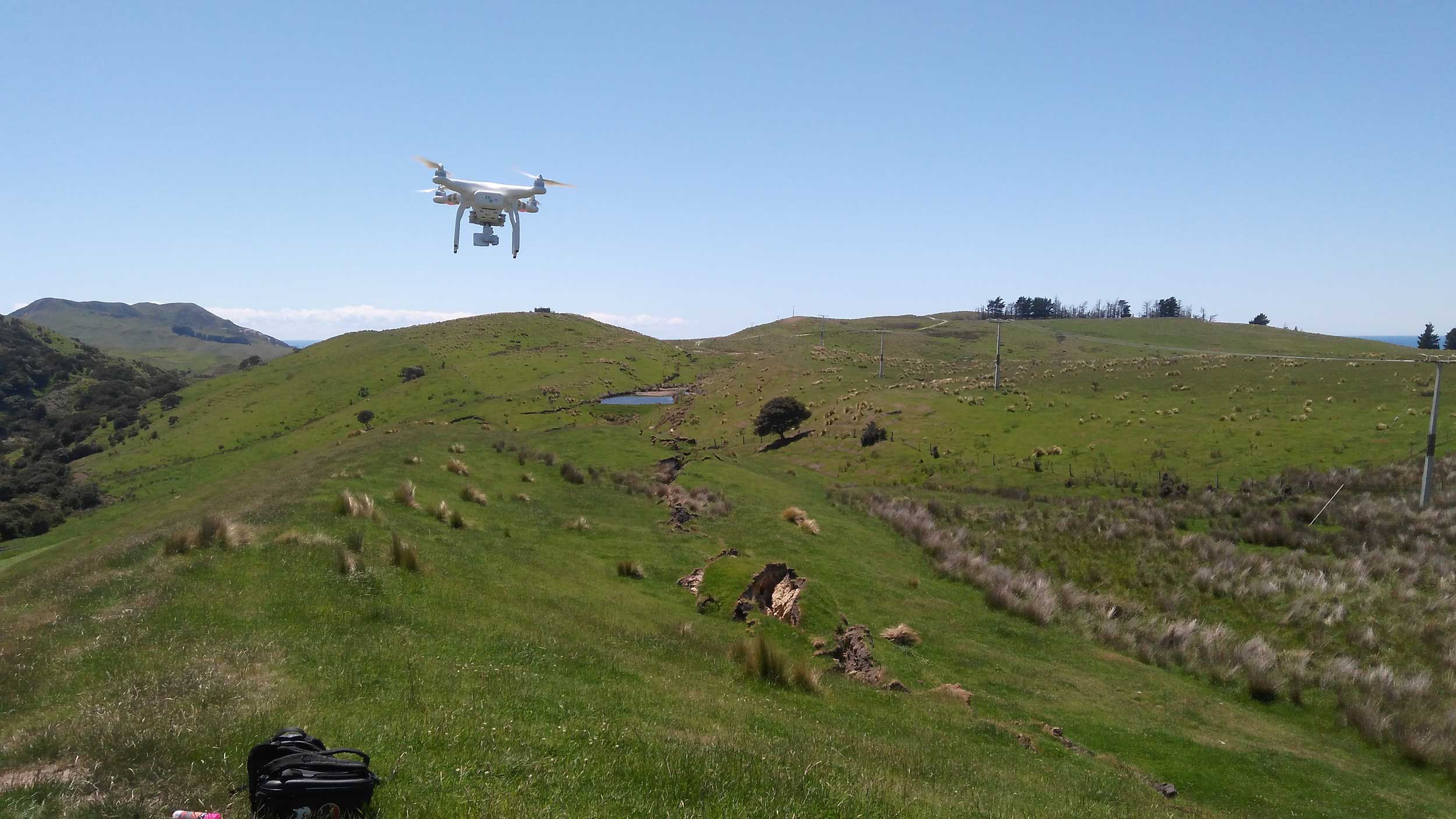 A University of Michigan drone inspecting a fault rupture site in New Zealand. Image credit: John Manousakis