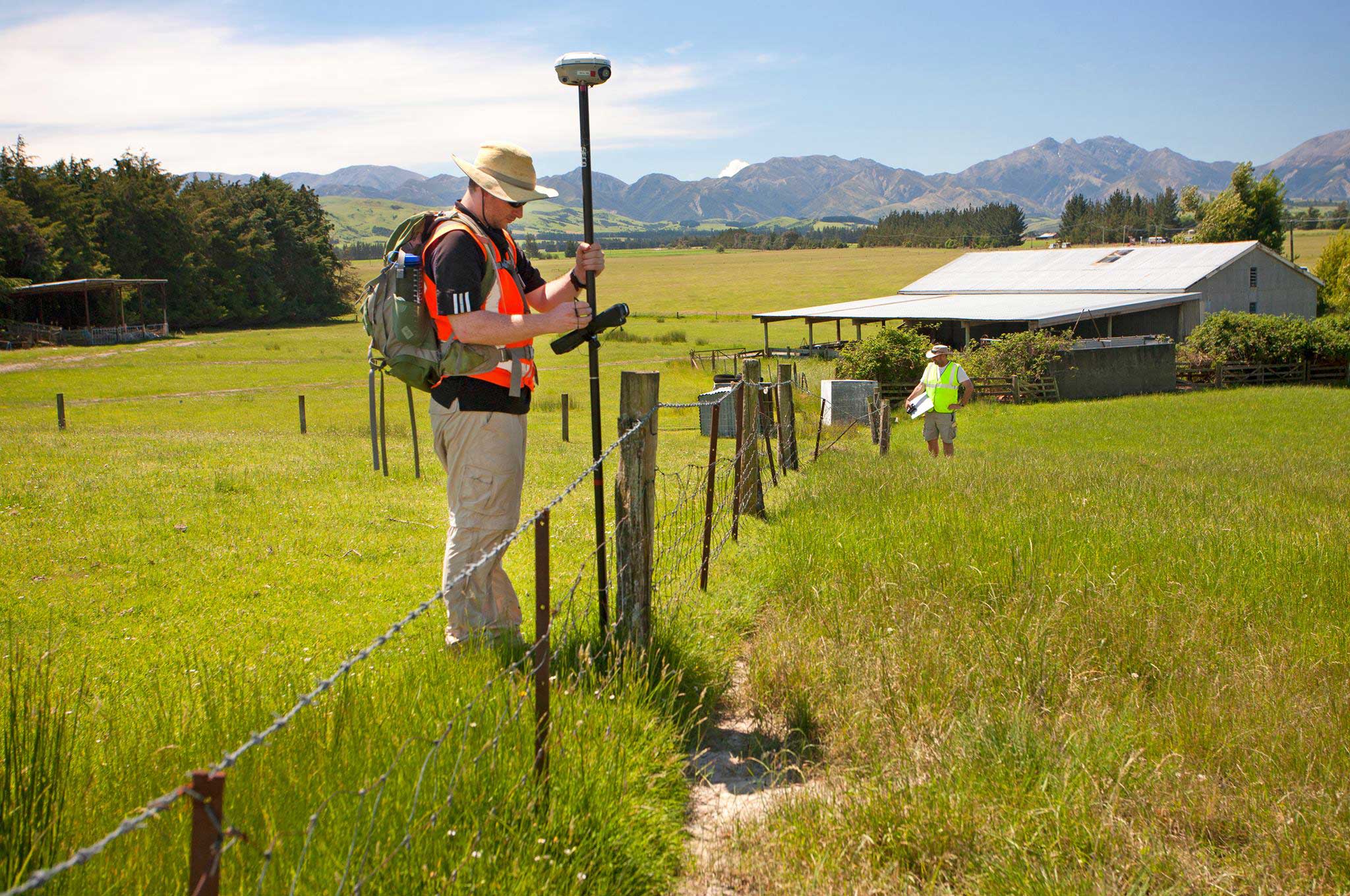 University of Michigan postdoctoral researcher Timothy Stahl uses GPS technology to measure displacement of a fence in New Zealand following November’s magnitude-7.8 earthquake. Fence posts in the mid-ground were moved to the right by motion of the fault during the earthquake. Image credit: Kate Pedley
